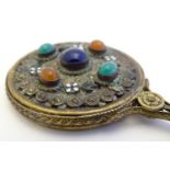 A 19thC gilt metal miniature hand mirror with applied hardstone cabochons and enamel flower