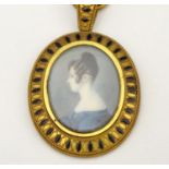 A 19thC English School watercolour and bodycolour oval portrait miniature set within a gilt metal