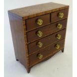 A 19thC/Regency miniature 'apprentice piece' chest of drawers, two over three configuration,