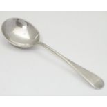 A silver ladle with Royal coat of arms to back of bowl. Hallmarked Sheffield 1936 maker Roberts &