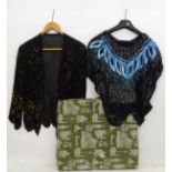 A jacket style top with black bugle beads with a stylisted gold bugle bead pattern. Black sequin