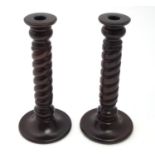 A pair of vintage barley twist wooden candlesticks Please Note - we do not make reference to the