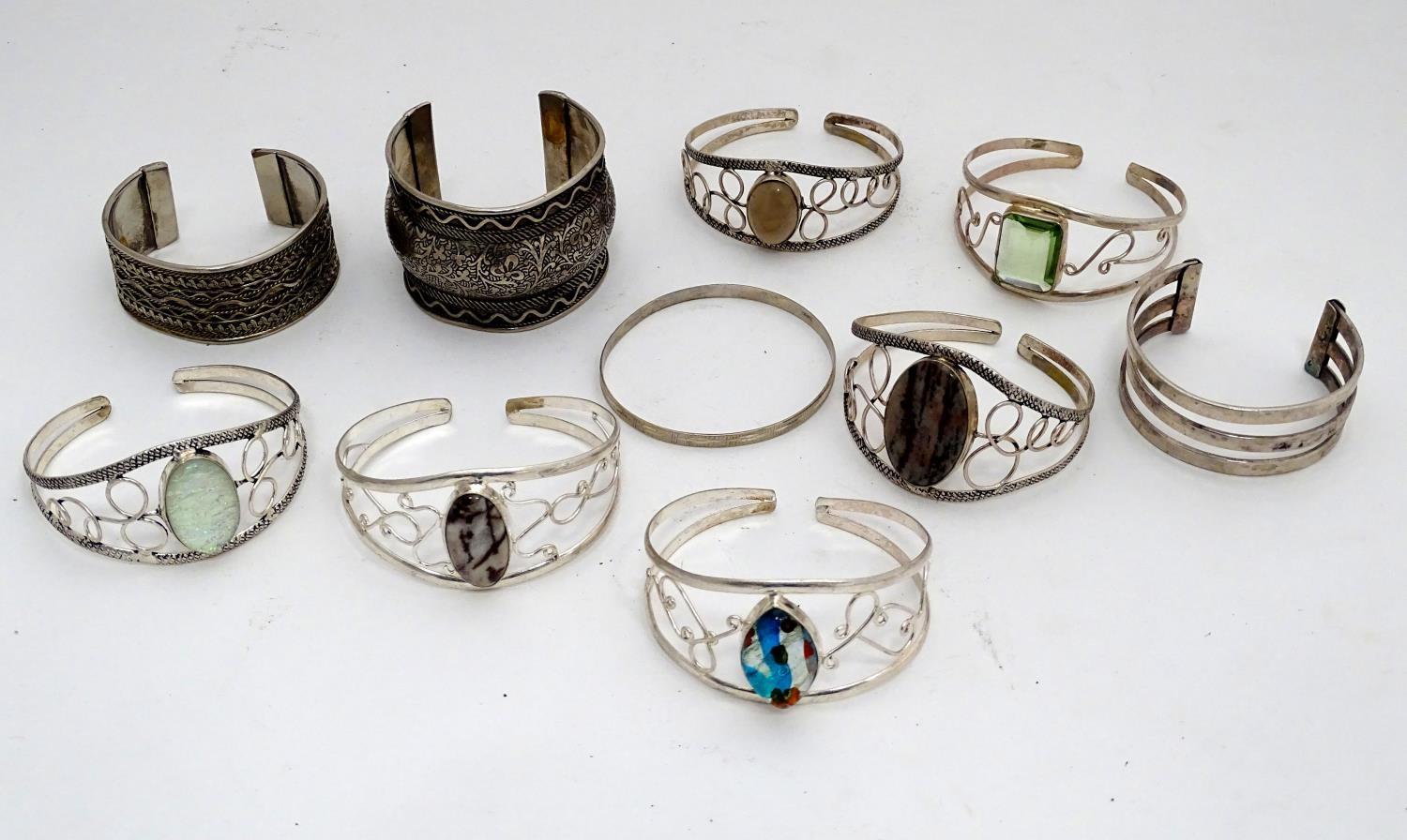 A quantity of white metal bangles Please Note - we do not make reference to the condition of lots