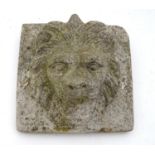 A composite stone lions mask garden adornment. Please Note - we do not make reference to the