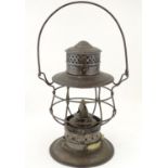 An oil lantern with carrying handle, 10'' tall Please Note - we do not make reference to the