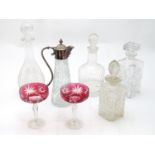 Quantity of glass decanters together with cranberry glass Champagne coupes. Please Note - we do