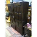 A large double wardrobe with linen fold decoration by Skull Furniture Please Note - we do not make