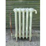 Garden and Architectural Salvage : an old painted cast iron radiator with 5 ribs, measuring 30 x