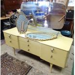 Vintage / Retro dressing table with mirrored back and glass shelf, together with an oval gilt wall