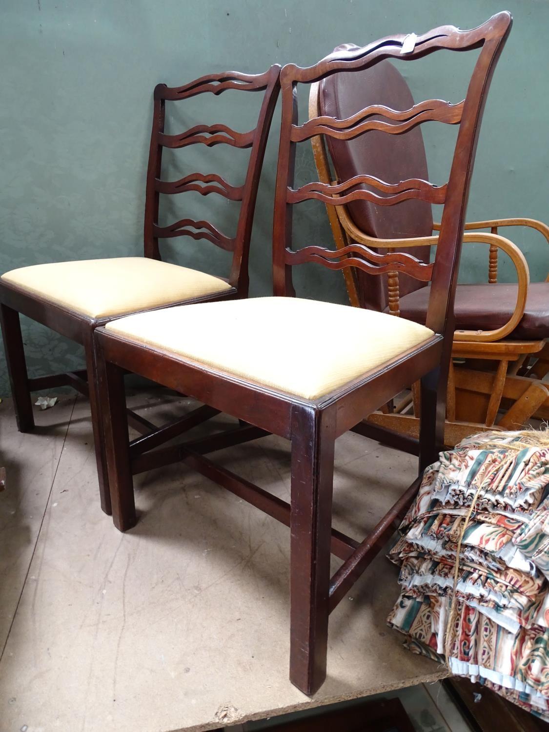 Two mahogany ladder back chairs Please Note - we do not make reference to the condition of lots