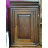 An oak corner cupboard Please Note - we do not make reference to the condition of lots within