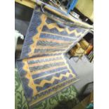 A blue and green ground modernist rug Please Note - we do not make reference to the condition of