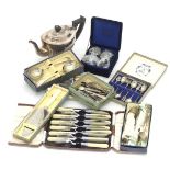 A box of assorted silver plate, to include table forks, knives, spoons and a silver plate teapot
