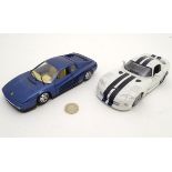 Toys: A Burago 1:24 scale dark blue Ferrari testarossa model car, 1984; together with a Maisto 1: