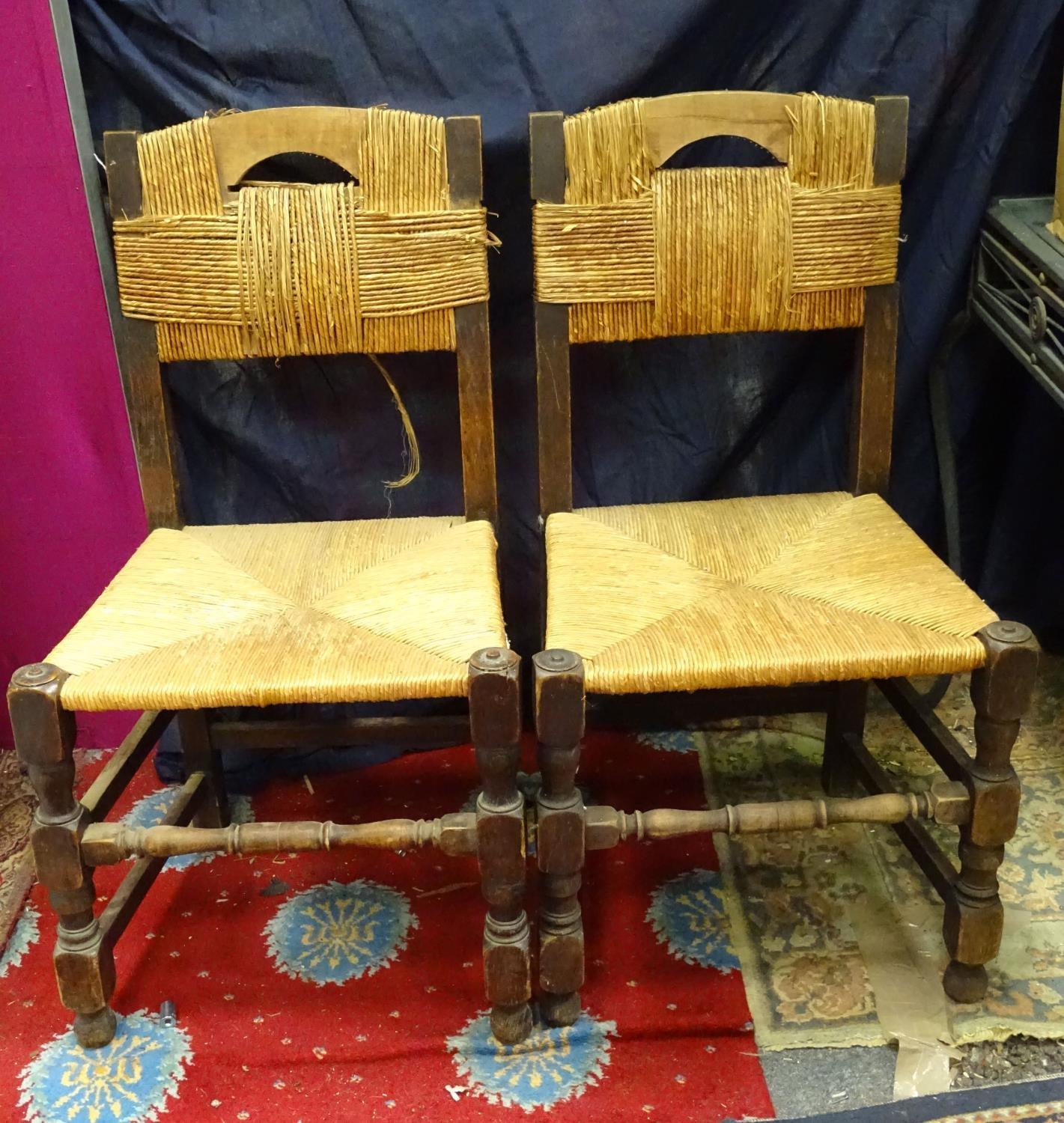 Pair of rush seated open arm chairs Please Note - we do not make reference to the condition of