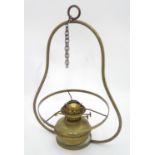 A brass oil lamp pendant fitting Please Note - we do not make reference to the condition of lots