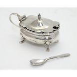 A silver mustard pot hallmarked Sheffield 1908 maker Walker & Hall with spoon hallmarked Sheffield