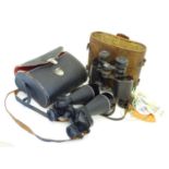 Two pair of field glasses, comprising a pair of cased Prinz 12 x 50 binoculars and a pair by H Bell,