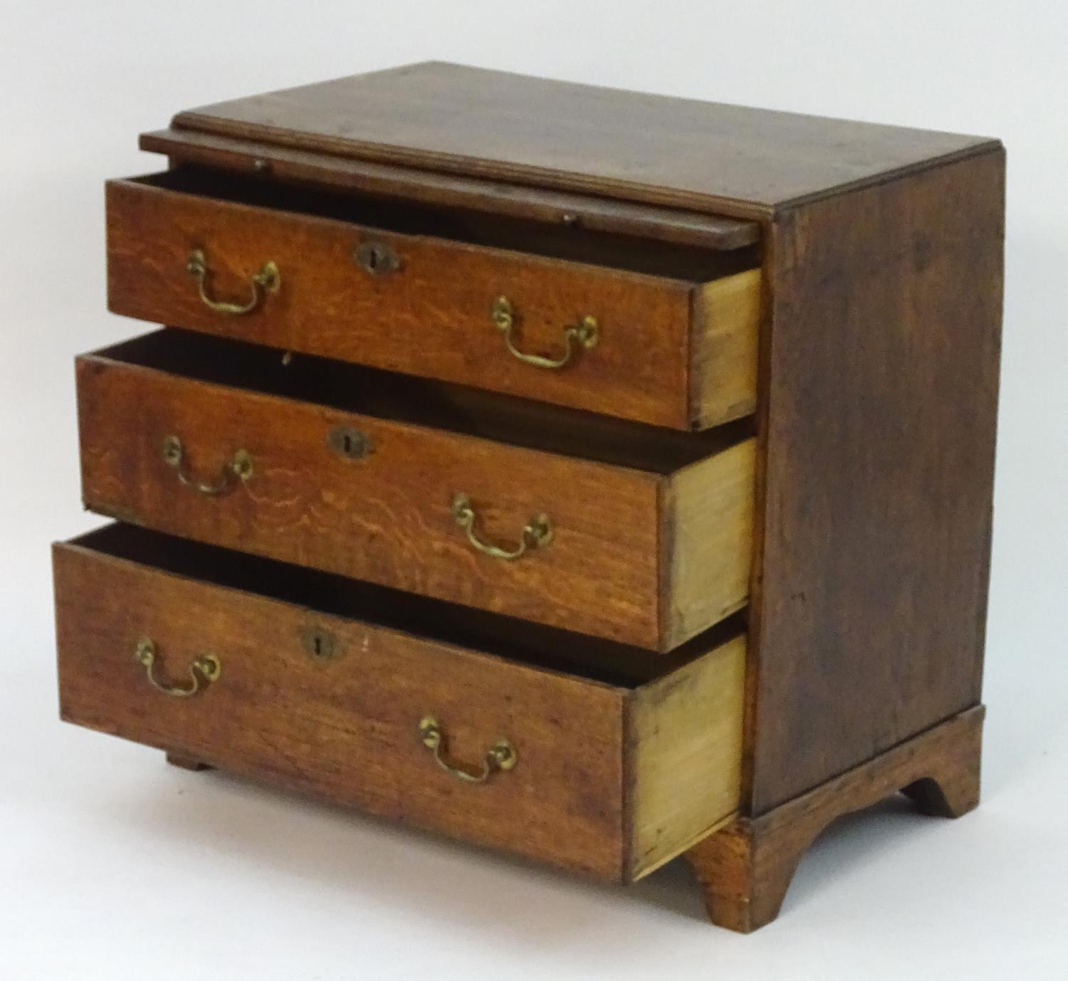 A mid 18thC oak chest of drawers with a rectangular top above a brushing slide and three long - Image 4 of 7