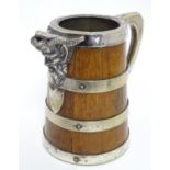 A Victorian coopered jug, constructed of oak with silver plated banding, mounts and interior. The