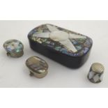 A papier mache snuff box, the hinged lid with mother of pearl and abalone decoration. Together