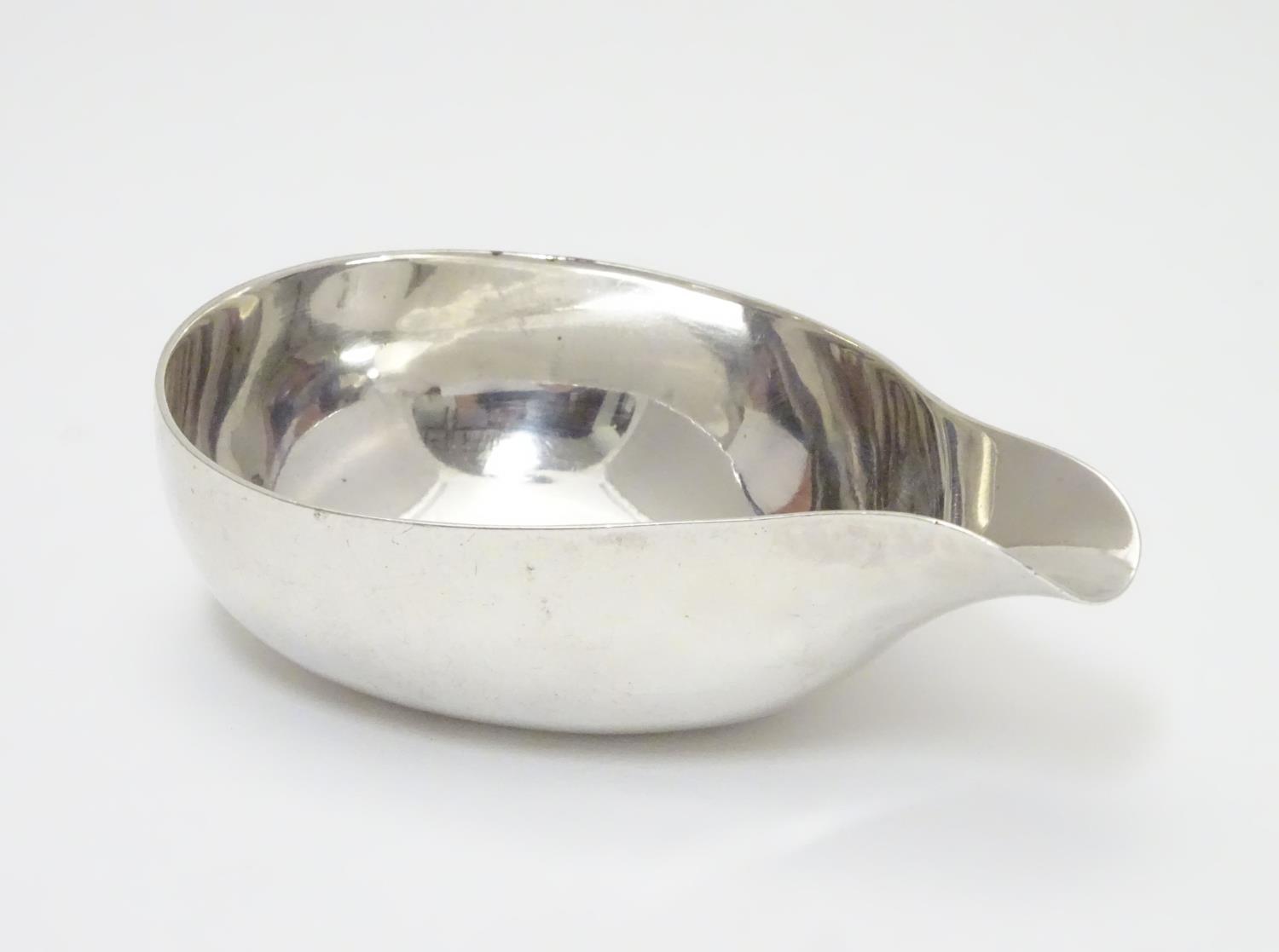 A Geo III silver pap boat hallmarked London c. 1763 maker W.H ? Approx 4 1/4" long (60g) Please Note