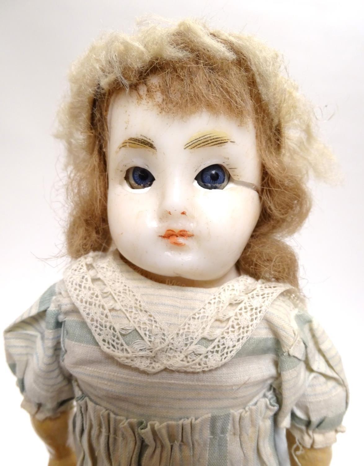 Toy: A wax headed doll with blue eyes, painted features, brown hair, composite forearms and - Image 6 of 9