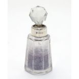 A cut glass scent bottle with silver collar hallmarked Birmingham 1932 maker W J Myatt & Co 3 1/4"