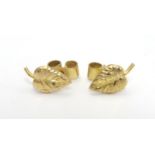 A Pair of 9ct gold stud earrings formed as leaves. Approx 3/8" long Please Note - we do not make