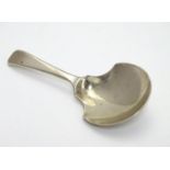 A silver caddy spoon hallmarked London 1793 maker Thomas Wallis. 3 1/2" long Please Note - we do not