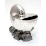 A late 19th / early 20thC silver plate spoon warmer formed as a nautilus shell. Approx. 6" high
