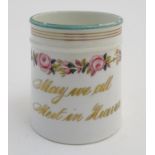A Victorian porcelain mug bearing the motto 'May we all Meet in Heaven' in gilt lettering with a