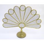 A Victorian brass fire screen of peacock tail form. Approx. 22 1/2" high Please Note - we do not