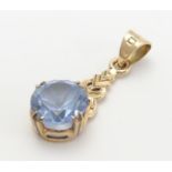A 9ct gold pendant set with Aquamarine. approx 1" long overall Please Note - we do not make