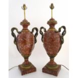 A pair of early 20thC table lamps, formed as classical urns with serpent/ snake formed handles and
