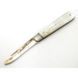 A mother of pearl handled folding fruit knife with silver blade. Hallmarked Sheffield 1912 maker