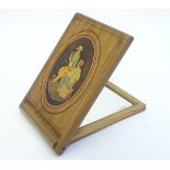 An Italian Sorrento ware travelling folding mirror with inlaid oval decoration of figures playing