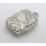 A Victorian silver vinaigrette with engraved decoration and gilded interior. Hallmarked Birmingham