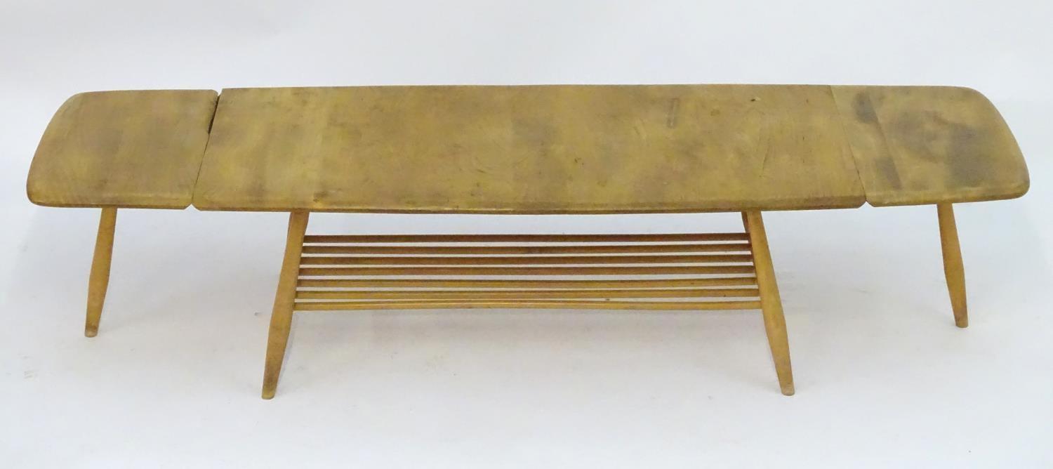 Vintage Retro, Mid-Century: an Ercol elm and beech coffee table, extending with drop flaps, standing - Image 7 of 7