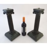 A pair of hardwood lamp bases/supports formed as Ionic columns, with green patinated finish, each