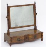 A 19thC mahogany toilet / dressing table mirror with a rectangular surround, turned tapering