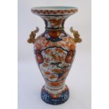 A large Oriental baluster vase with a flared rim and twin handles formed as stylised clouds.