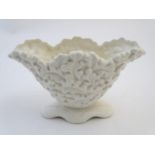 A Sylvac posy holder / vase, the body moulded with a leaf pattern in a white glaze. Approx. 6 1/4"