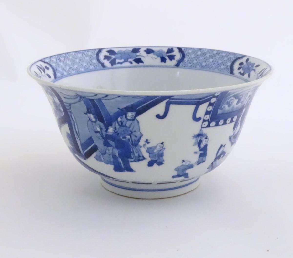 A Chinese blue and white footed bowl with a flared rim, decorated with a scene depicting the - Image 3 of 7