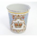 A Victorian enamel beaker celebrating Queen Victoria's Diamond Jubilee, depicting the royal coat