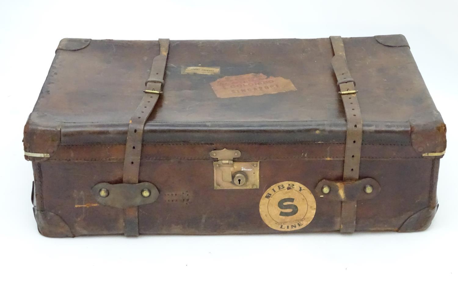 A late 19thC leather travelling trunk flanked by carrying handles. 34" long x 19" wide x 11" high. - Image 3 of 10