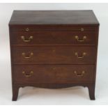 A mid / late 18thC mahogany chest of drawers with a rectangular top above a brushing slide and three