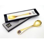 A Georg Jensen silver gilt and enamel 1974 year spoon, with floral enamel corn cockle decoration