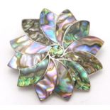 A Mexican silver brooch set with abalone / paua shell detail 1 3/4" wide Please Note - we do not