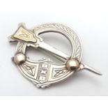 An Irish silver Tara kilt-pin of Pseudo Penannular form with gilt detail. Hallmarked Dublin 1960